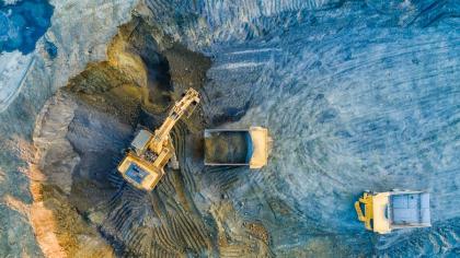 Mining vehicles in an open mining pit